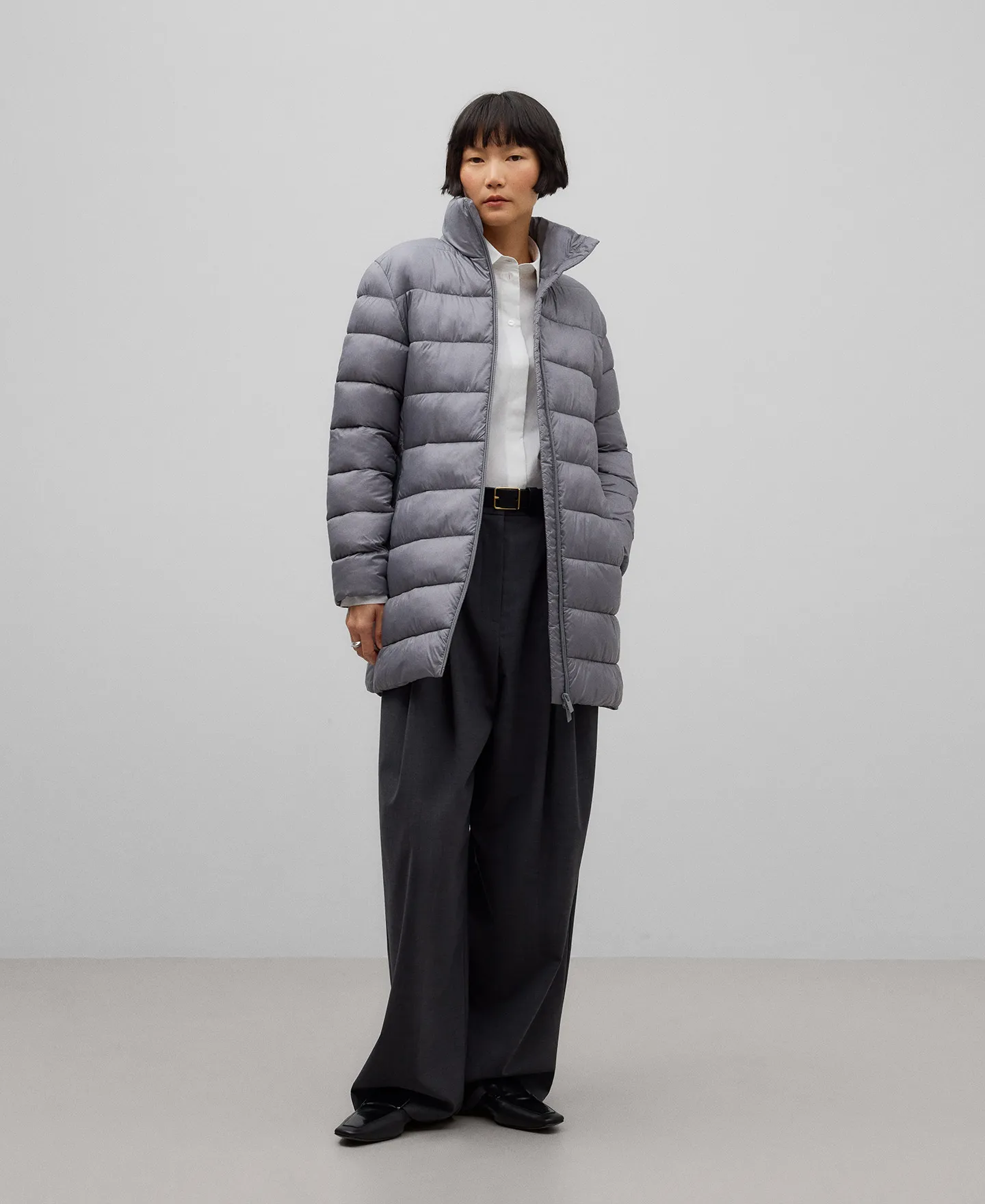 Grey quilted long jacket woman