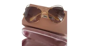 Miu Miu Gafas de sol Dorado 