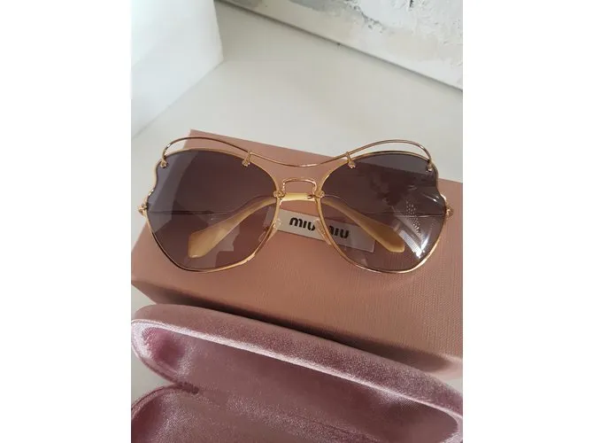 Miu Miu Gafas de sol Dorado 